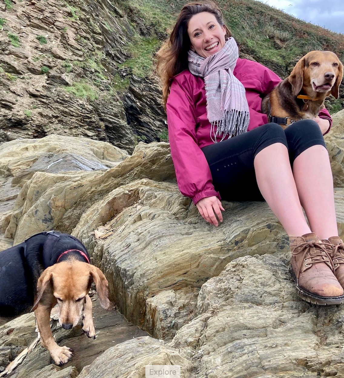 Juliet outdoors on a walk with her dogs